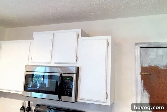 A recent snapshot of the kitchen showing cabinets and walls, hinting at the ongoing renovation process