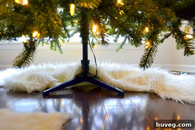 Back view of a Christmas tree with layered faux sheepskin remnants as a skirt