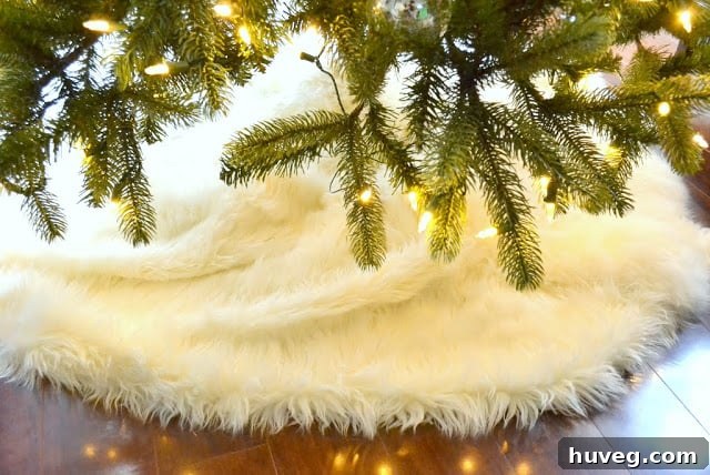 Front view of a Christmas tree with a luxurious no-sew faux sheepskin tree skirt