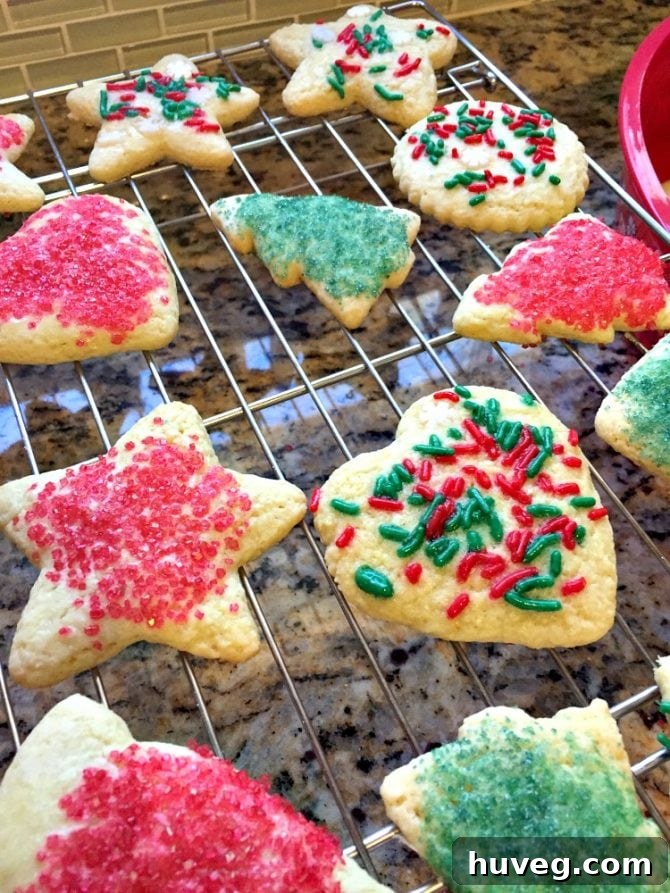 super soft and chewy hard boiled egg cookies cooling on wire rack with red and green sanding sugar and sprinkles