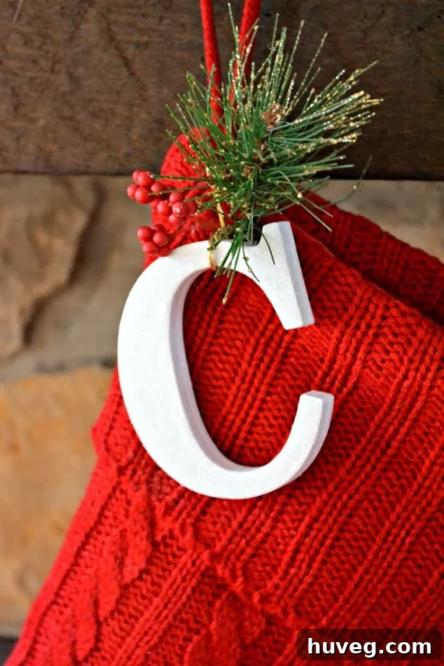Close-up of DIY Christmas stocking initial with hook and embellishments