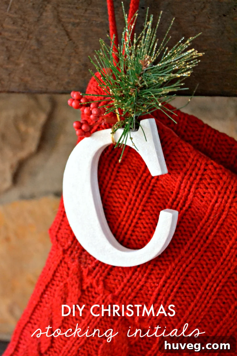Completed DIY Christmas stocking initials with hook and festive decor