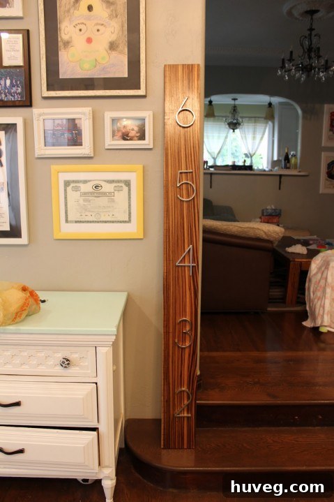 A personalized family growth chart by Picardy Project, resembling an oversized tape measure.