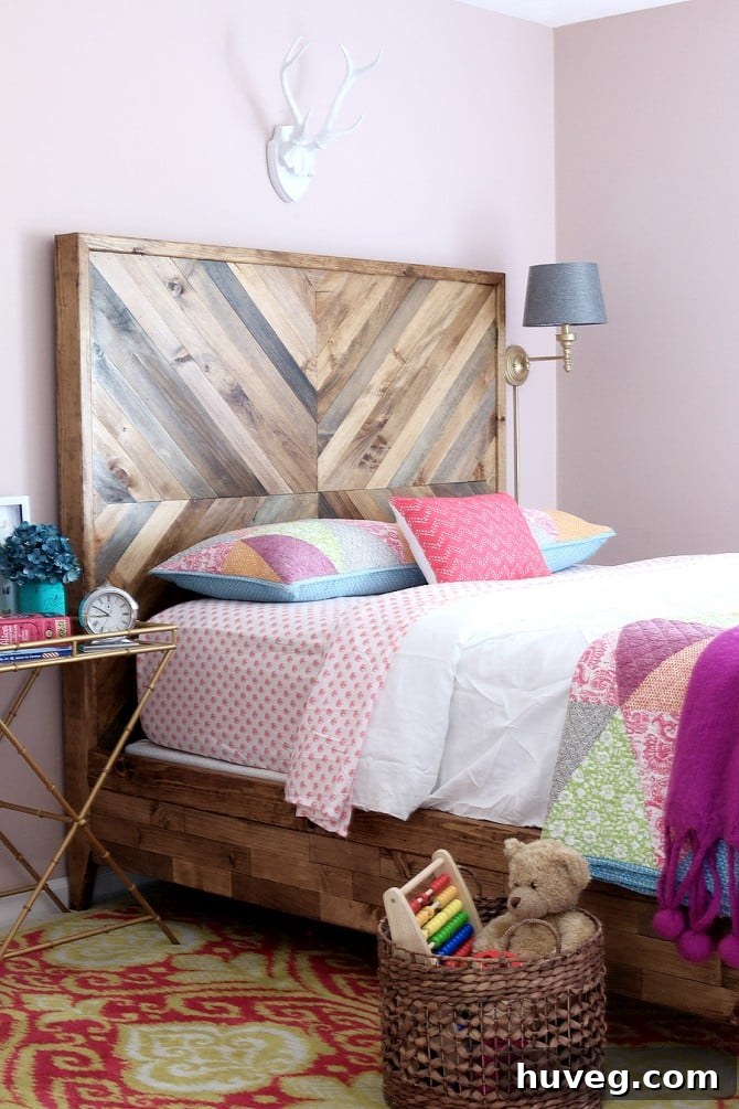 A beautiful DIY reclaimed wood bed by House of Wood, featuring varied wood grains and tones.