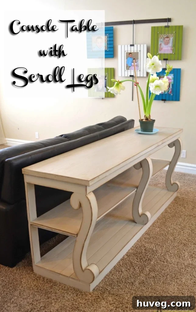 An elegant console table with distinctive scroll legs by Her Tool Belt, showcasing refined woodworking.
