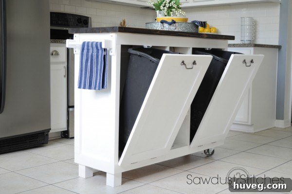 A stunning kitchen island repurposed from a garage sale cabinet by Sawdust 2 Stitches, showcasing extreme transformation.