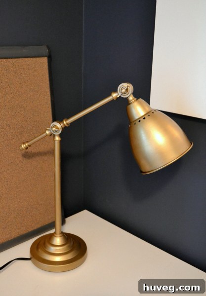 IKEA Barometer lamp after its DIY gold makeover, now featuring a sophisticated metallic finish that elevates its design.