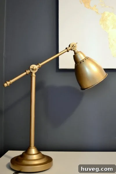Final reveal of the gold-painted IKEA Barometer lamp, beautifully integrated into a home office setup.