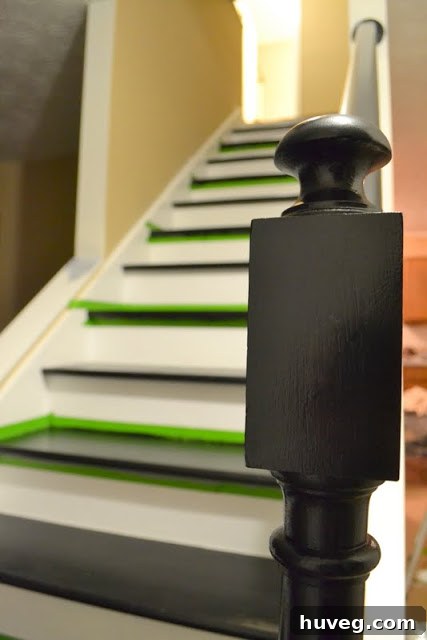 Stairs in progress, partly painted with tape