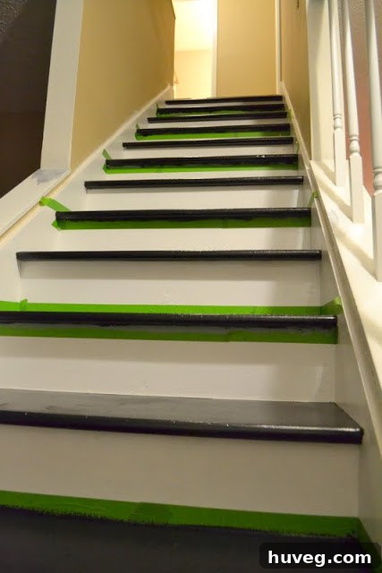 Close up view of the newly painted stairs with alternating black and white steps