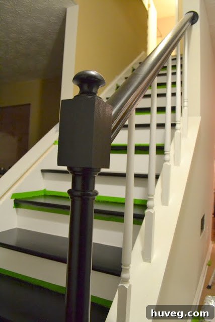 Top-down view of the painted stairs from the upper landing