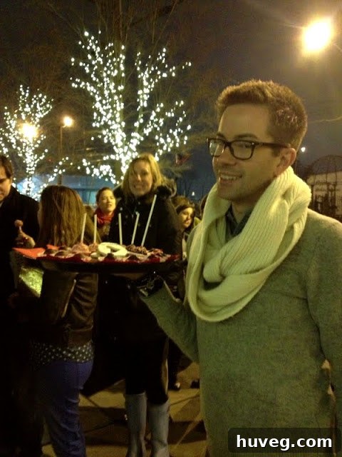 Flor staff handing out treats to attendees waiting in line for the book signing.