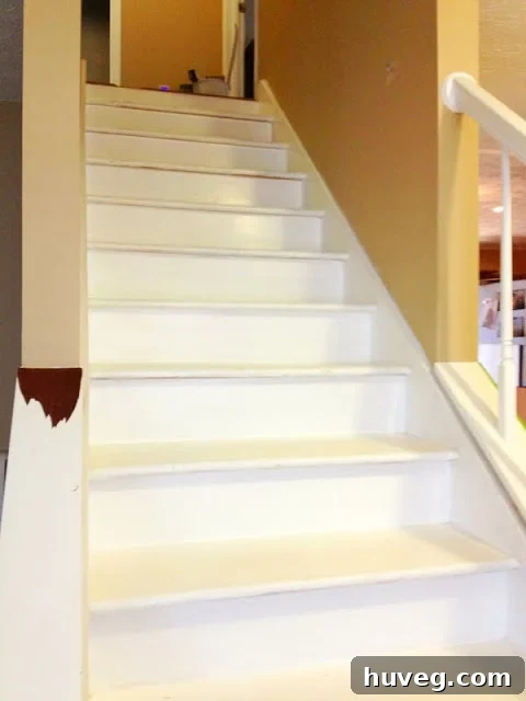 Old, unpainted staircase before renovation