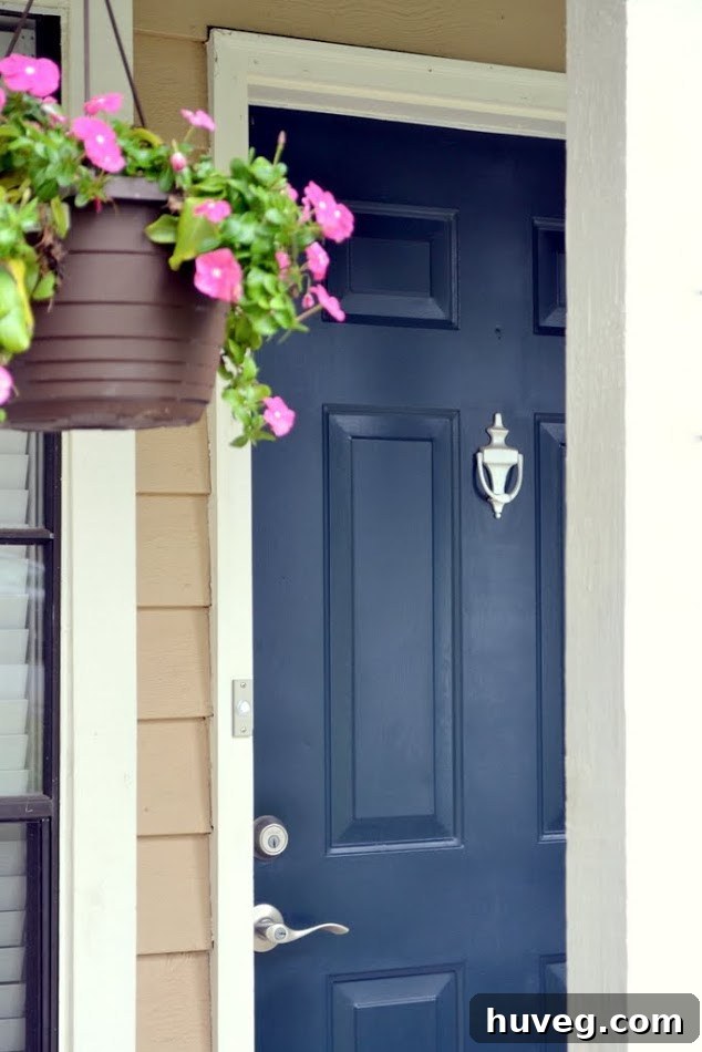 Newly renovated front door with a modern, fresh look and vibrant paint color