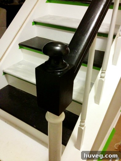 Staircase painting progress with black and white contrasts