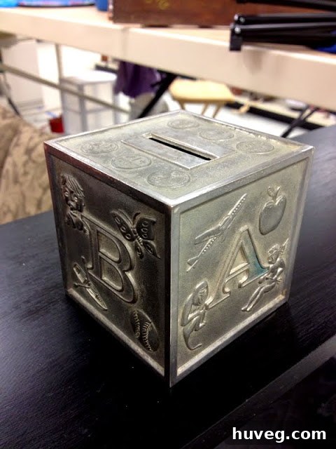 Heavy, decorative item at a thrift store, possibly a bookend or child's decor