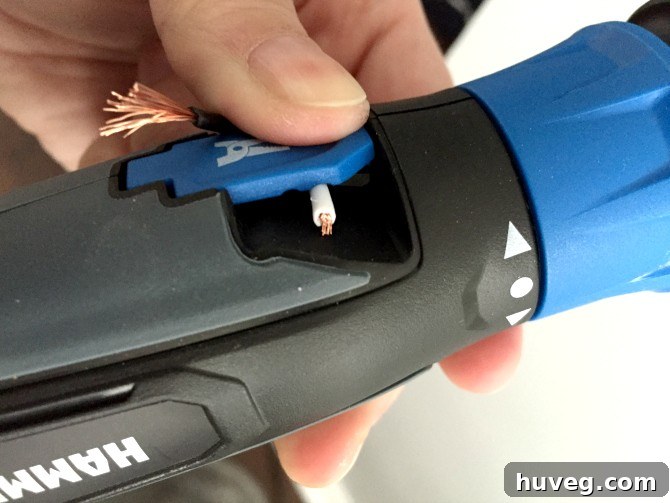 Using Hammerhead Tool to Strip Wires for Light Fixture