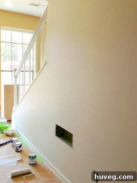 Stair wall freshly painted with White Dove