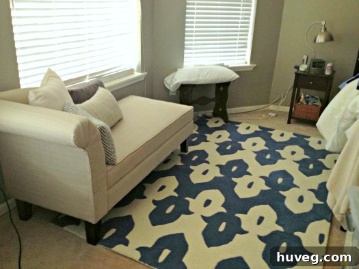 Stylish area rug next to the bed, enhancing bedroom aesthetics