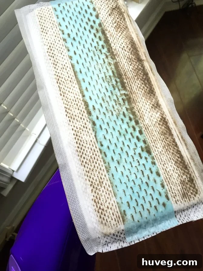 Swiffer WetJet effectively picking up stubborn dirt from floor