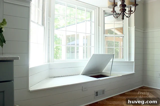 Hidden storage window seat with chest hinges by Pretty Handy Girl