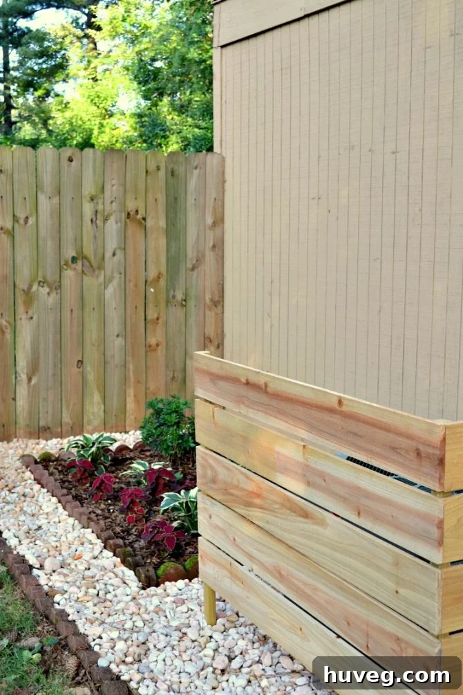 The finished wooden screen hides the air conditioner from view. 
