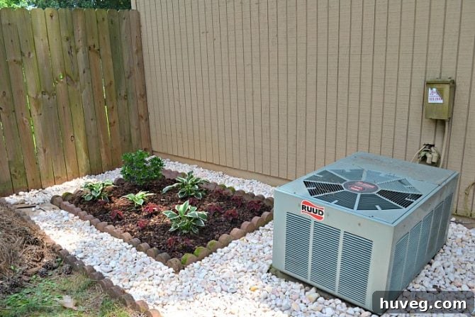 The side of my house looked great with egg rock and plants, but I still wanted to hide the air conditioner.