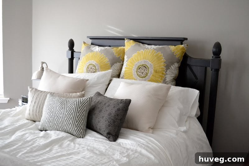 Freshly made bed with new bedding, a cozy and reorganized primary bedroom space.