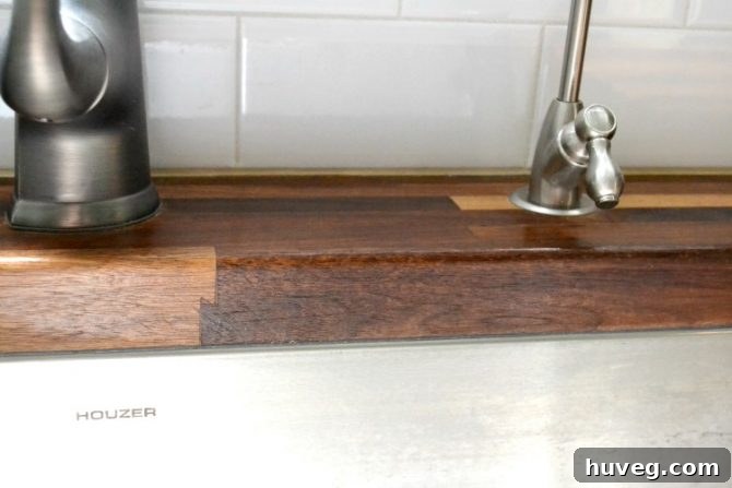 Newly cleaned Houzer stainless steel sink, sparkling after treatment