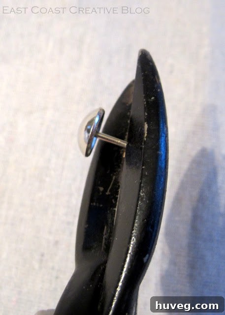Cut the upholstery tack for flush application