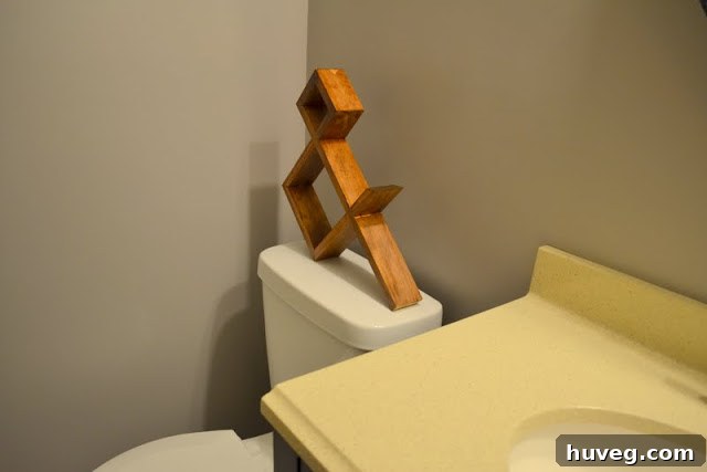 Ampersand sculpture in guest bathroom