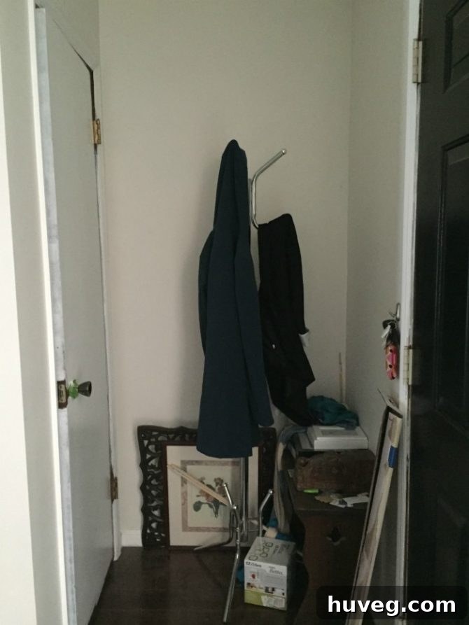 Cluttered and disorganized entryway before home renovation