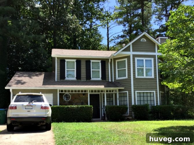 Example of a renovated house exterior featuring white trim and classic window shutters, providing realistic design ideas for a similar home.