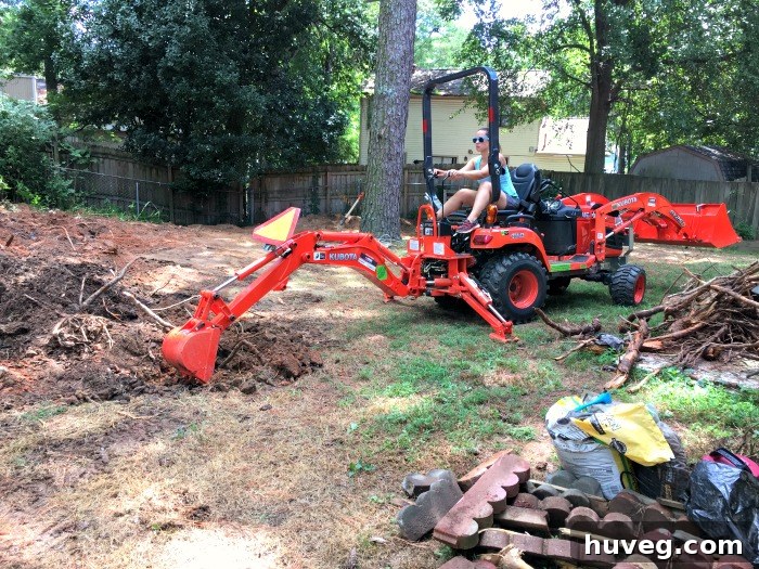 Sarah operating the backhoe, navigating the challenges of heavy equipment use.