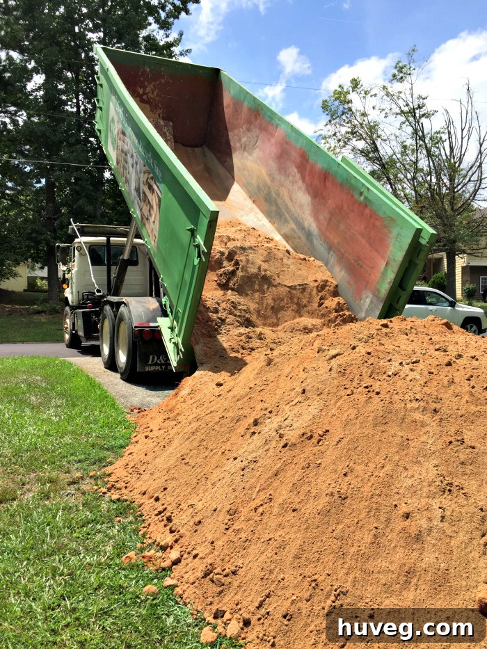 A giant pile of fill dirt from 81 Recycling, used for a backyard leveling project.