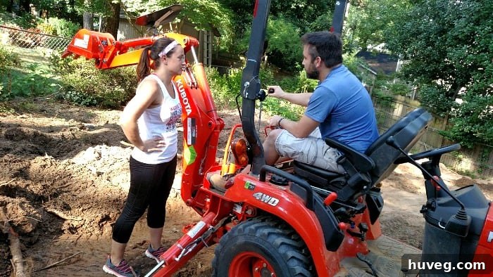 Instructor going through detailed instructions on operating the backhoe with students.